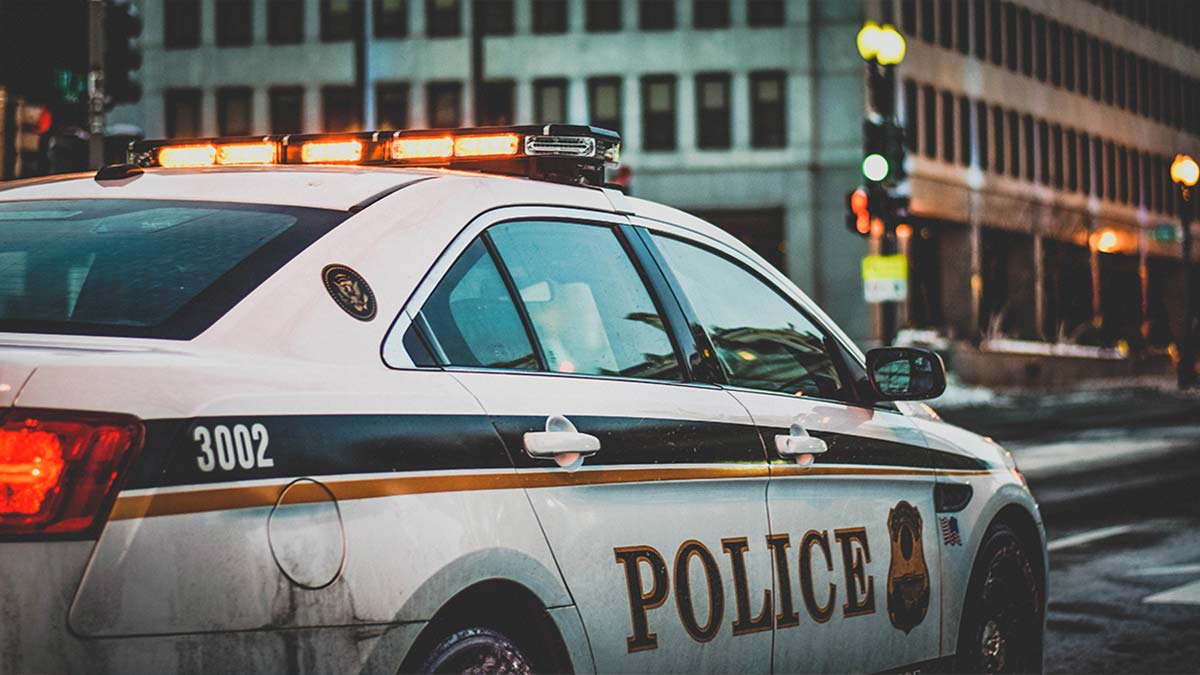 police car monitoring city streets