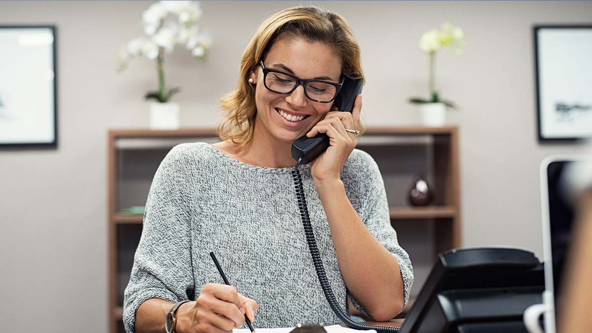 Happy mature woman talking on phone