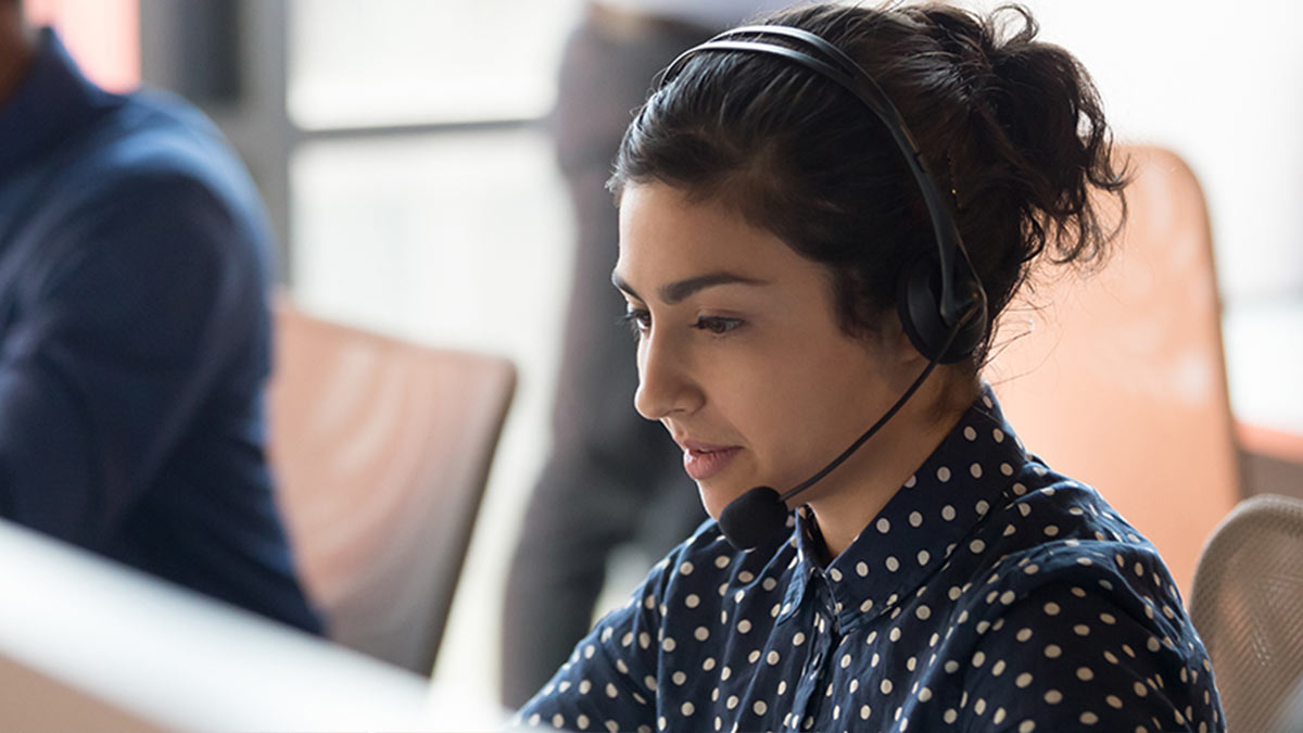 young contact center agent with phone headset