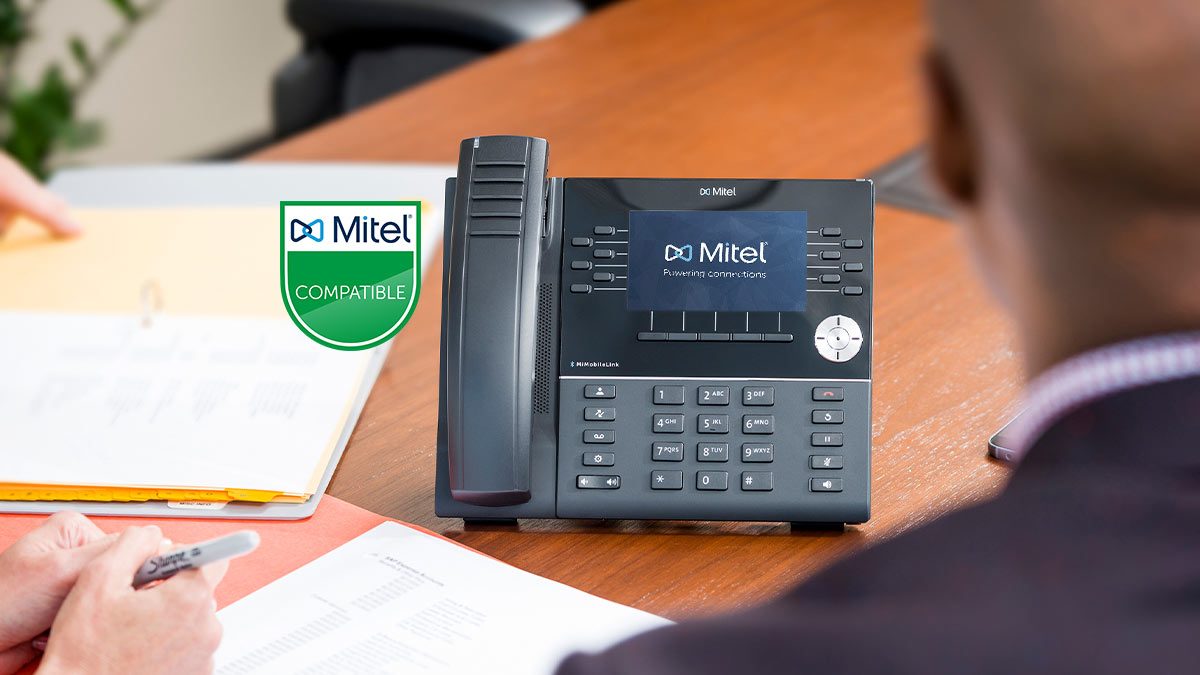 close up of a mitel-certified phone in a conference room
