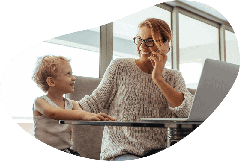 woman working from home with son