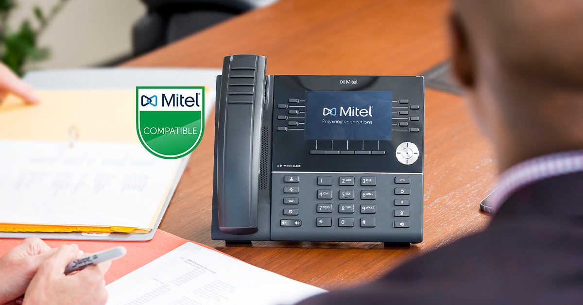 close up of a mitel-certified phone in a conference room